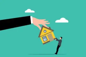 A hand presents a small house to a man, symbolizing the concept of secured loans in a financial blog context