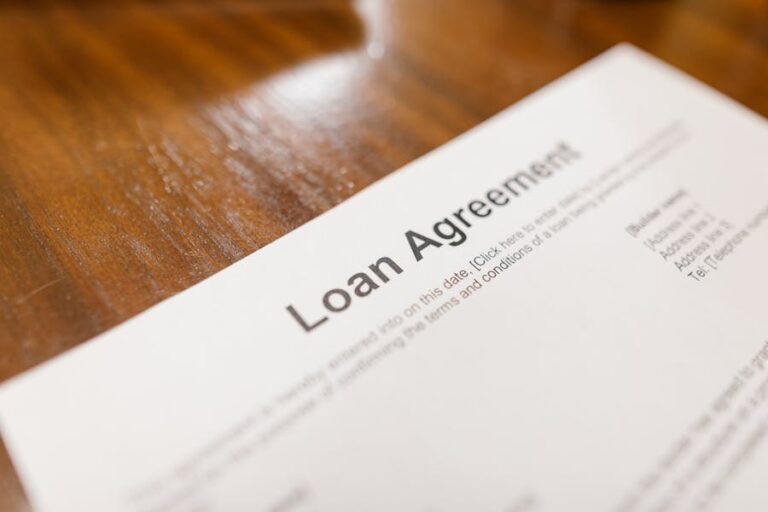 A loan agreement displayed on a table, illustrating various loan types in the UK