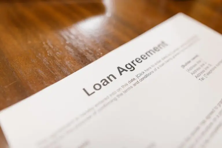 A loan agreement displayed on a table, illustrating various loan types in the UK